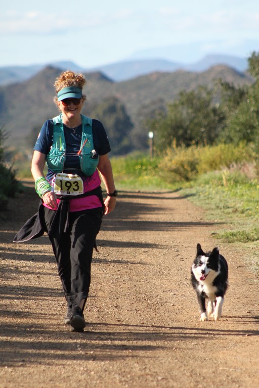 lady and dog running